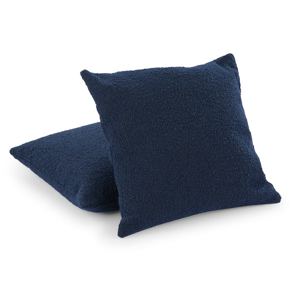 Aether Bouclé Pillow Set on a modern sofa showcasing textured fabric and feather-blend inserts