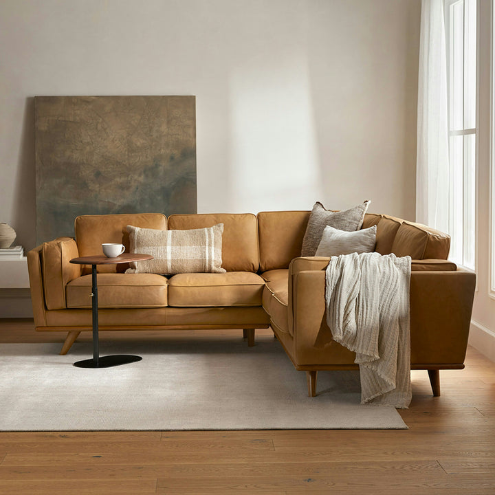 Aldermen Leather Corner Sectional in evolving patina with oak frame in modern loft