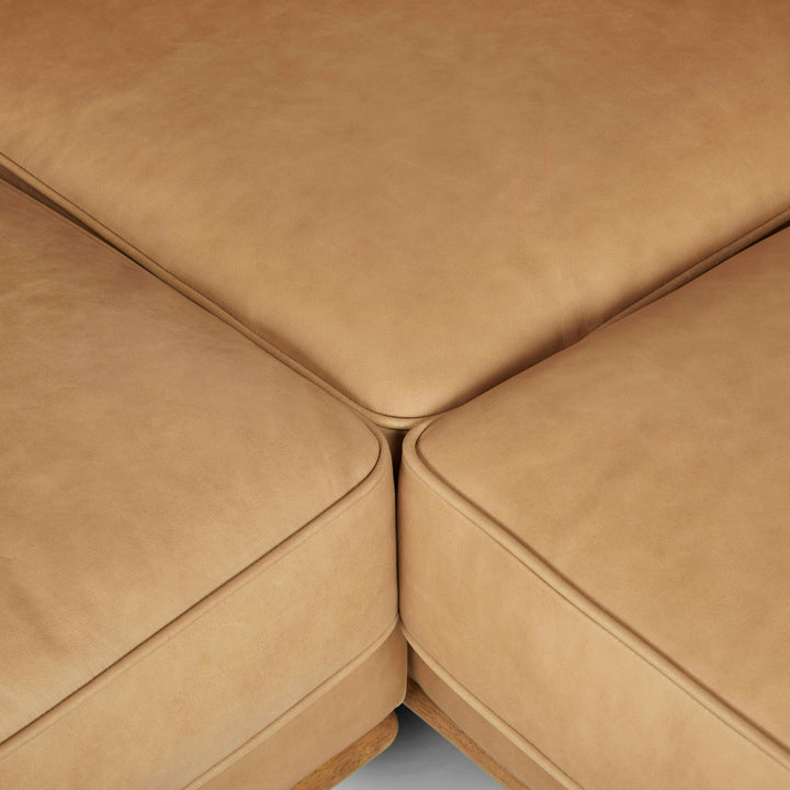 Aldermen Leather Corner Sectional in evolving patina with oak frame in modern loft