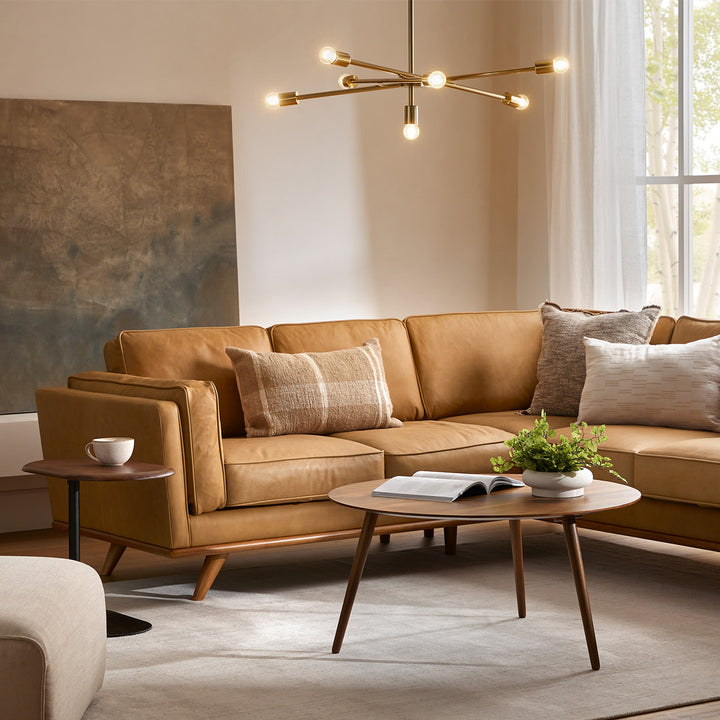 Aldermen Leather Corner Sectional in evolving patina with oak frame in modern loft