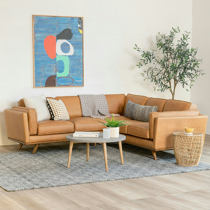 Aldermen Leather Corner Sectional in evolving patina with oak frame in modern loft