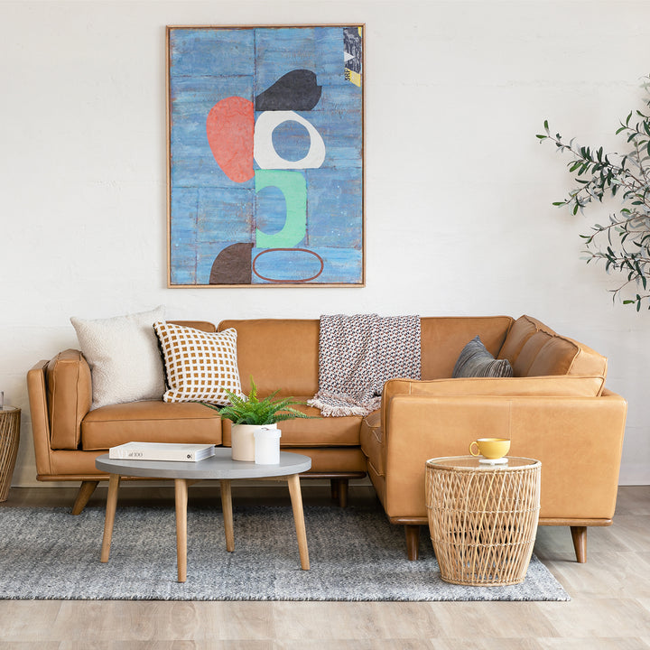 Aldermen Leather Corner Sectional in evolving patina with oak frame in modern loft