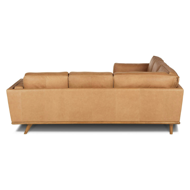 Aldermen Leather Corner Sectional in evolving patina with oak frame in modern loft