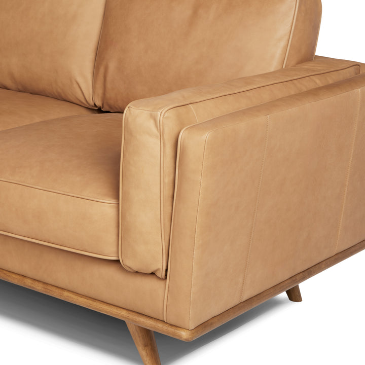 Aldermen Leather Corner Sectional in evolving patina with oak frame in modern loft