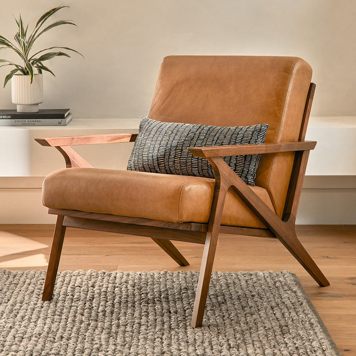 Amalfi Leather Lounge Chair in home library with books and reading lamp