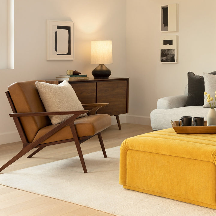 Amalfi Leather Lounge Chair in home library with books and reading lamp