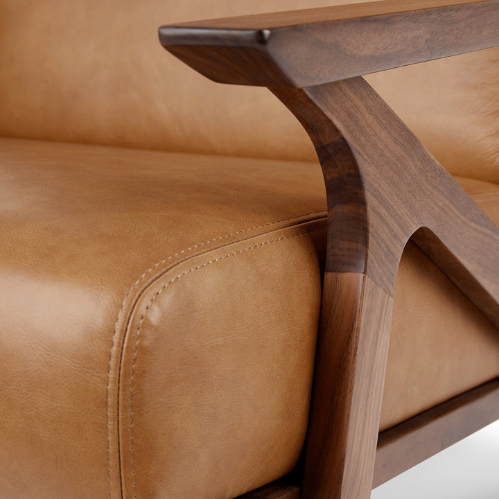 Amalfi Leather Lounge Chair in home library with books and reading lamp