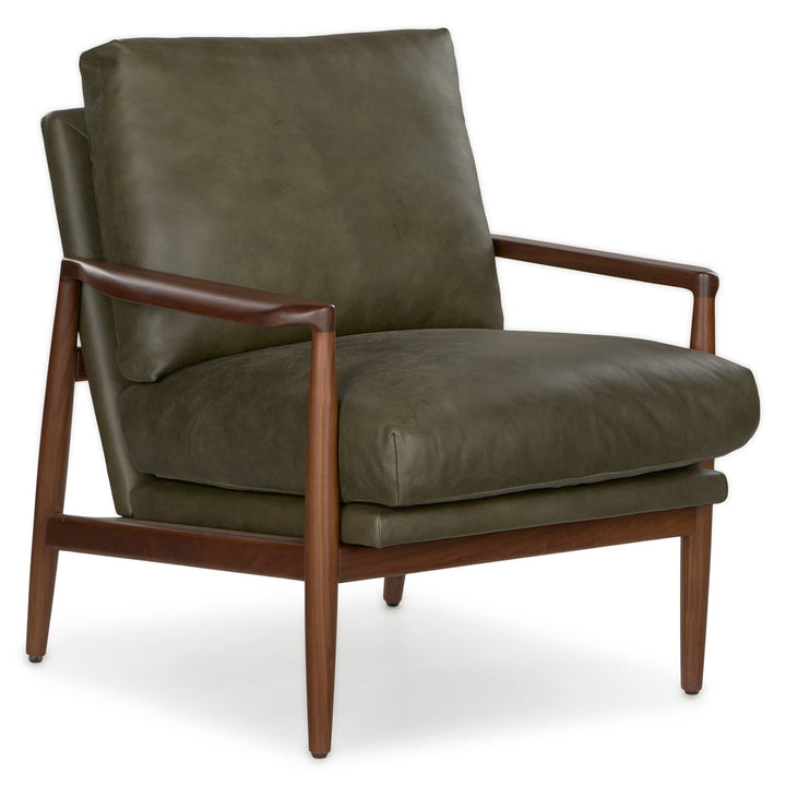 Aurelia Leather Lounge Chair with walnut legs in a sunlit mid-century modern living room