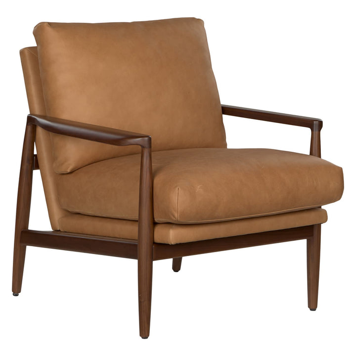 Aurelia Leather Lounge Chair with walnut legs in a sunlit mid-century modern living room