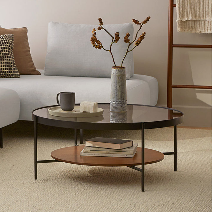 BRU Glass Coffee Table with smoked tempered glass top and walnut veneer shelf in a retro-modern living room