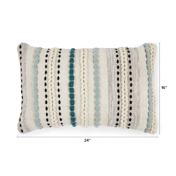Caelis Pillow on a neutral sofa with Moroccan-inspired weaving and wool shell