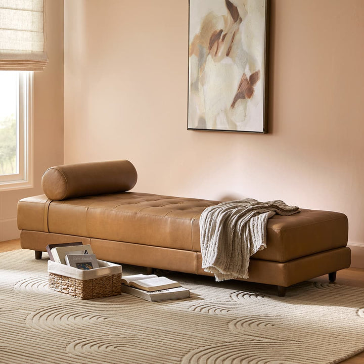 Caelum Leather Chaise Lounge in a sunlit mid-century modern living room with vintage rug