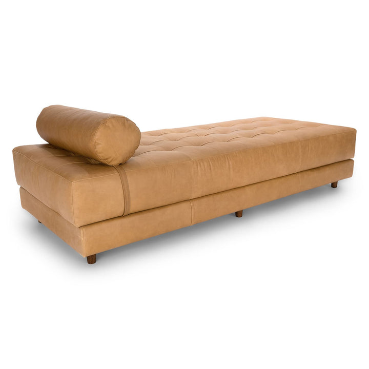 Caelum Leather Chaise Lounge in a sunlit mid-century modern living room with vintage rug