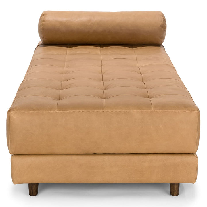 Caelum Leather Chaise Lounge in a sunlit mid-century modern living room with vintage rug