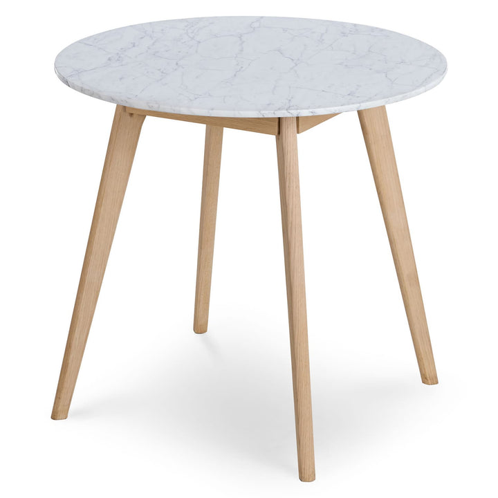Calypso Cafe Table with marble top and wood legs in a cozy breakfast nook