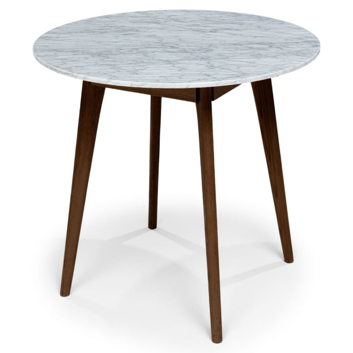 Calypso Cafe Table with marble top and wood legs in a cozy breakfast nook