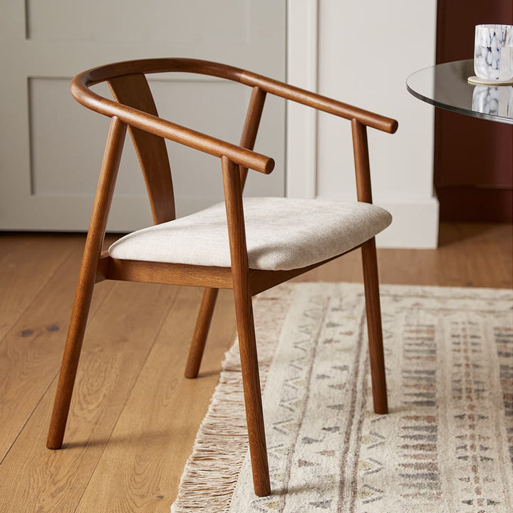 Cassiopeia Dining Chair with Y-shaped back and bentwood arms in a mid-century dining room