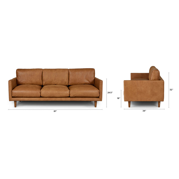 Chambers Leather Sofa in aged tan leather with sheepskin throw in industrial loft interior