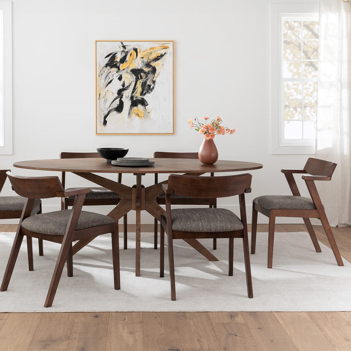 Cyrene Oval Dining Table with starburst walnut veneer in a mid-century modern dining room