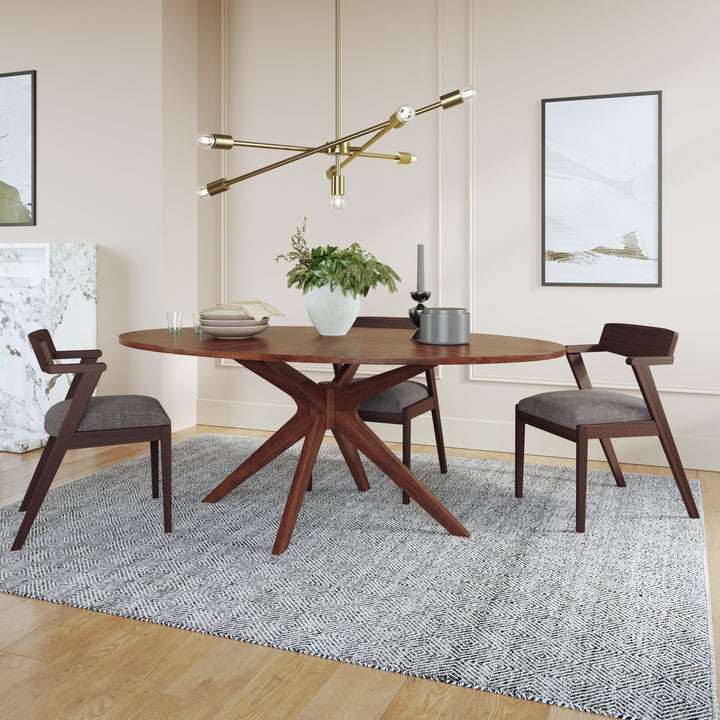 Cyrene Oval Dining Table with starburst walnut veneer in a mid-century modern dining room