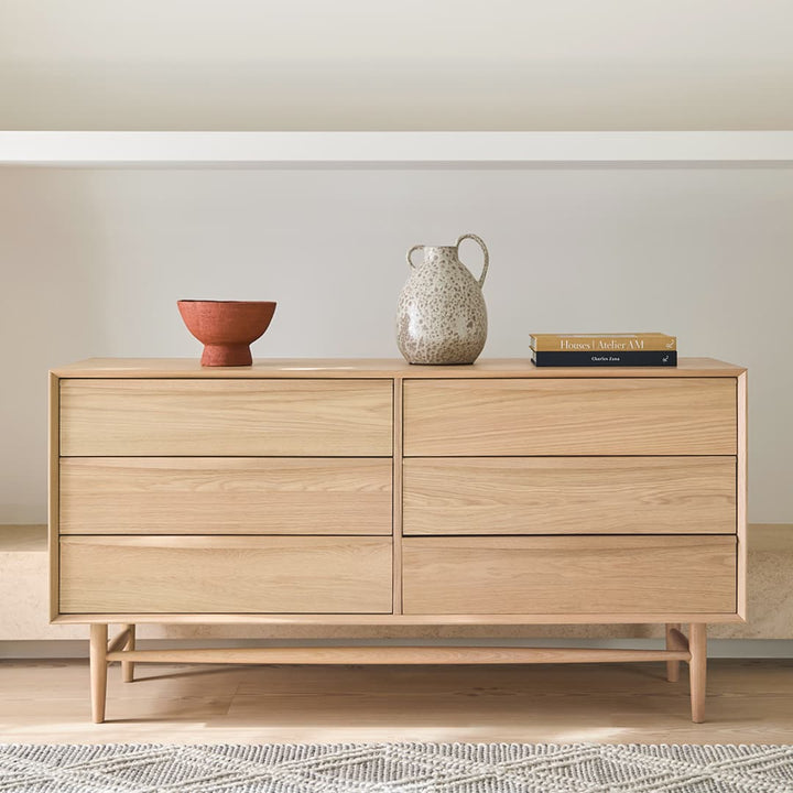 Elara 6-Drawer Double Dresser in a modern bedroom with natural wood grain and soft-close drawers
