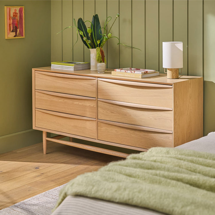Elara 6-Drawer Double Dresser in a modern bedroom with natural wood grain and soft-close drawers