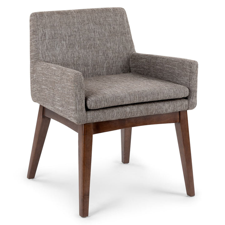 Fauces Dining Armchair pair in a modern dining room with splayed legs and upholstered seats