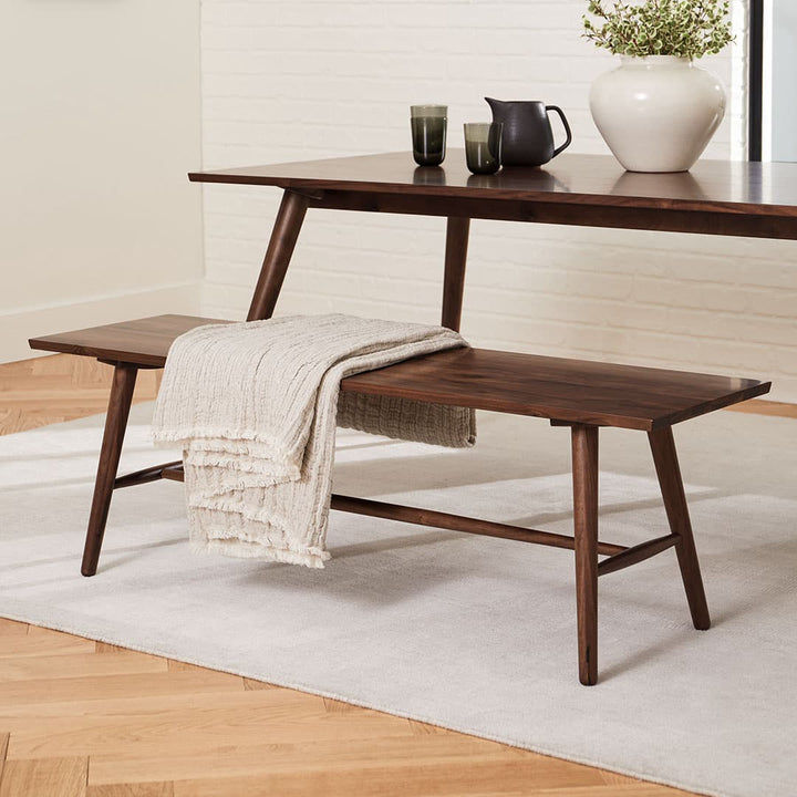 Halleberg Bench in Walnut beside the Seno Table in a modern dining area