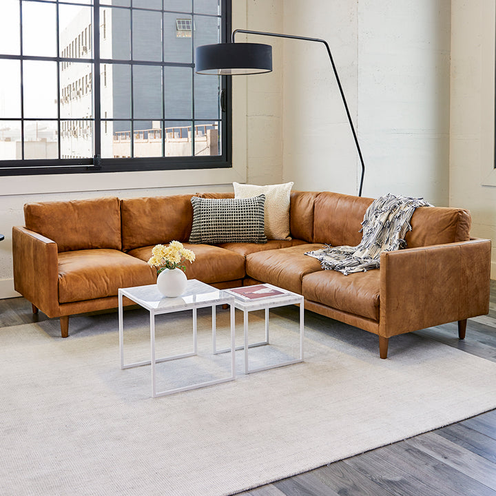 Harwell Leather Corner Sectional developing patina in mid-century modern living room