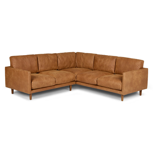 Harwell Leather Corner Sectional developing patina in mid-century modern living room