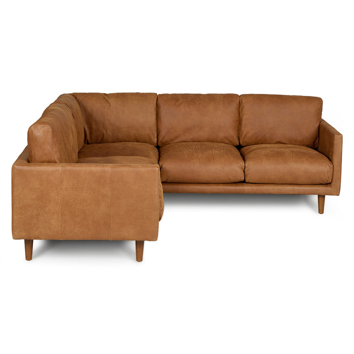 Harwell Leather Corner Sectional developing patina in mid-century modern living room