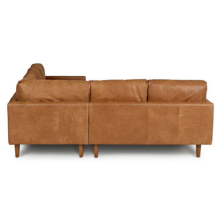 Harwell Leather Corner Sectional developing patina in mid-century modern living room