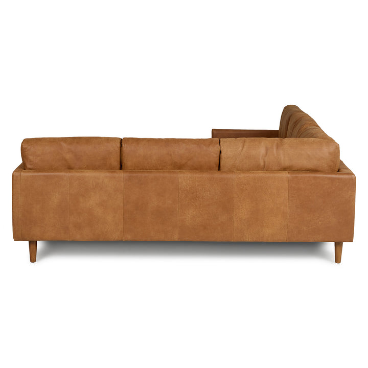 Harwell Leather Corner Sectional developing patina in mid-century modern living room