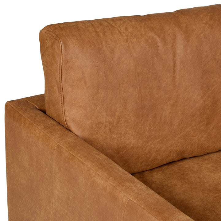 Harwell Leather Corner Sectional developing patina in mid-century modern living room