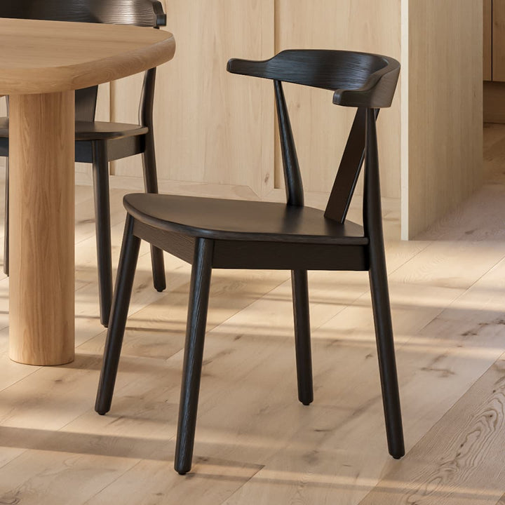 Helia Dining Chair in a farmhouse kitchen with solid wood construction and curved back