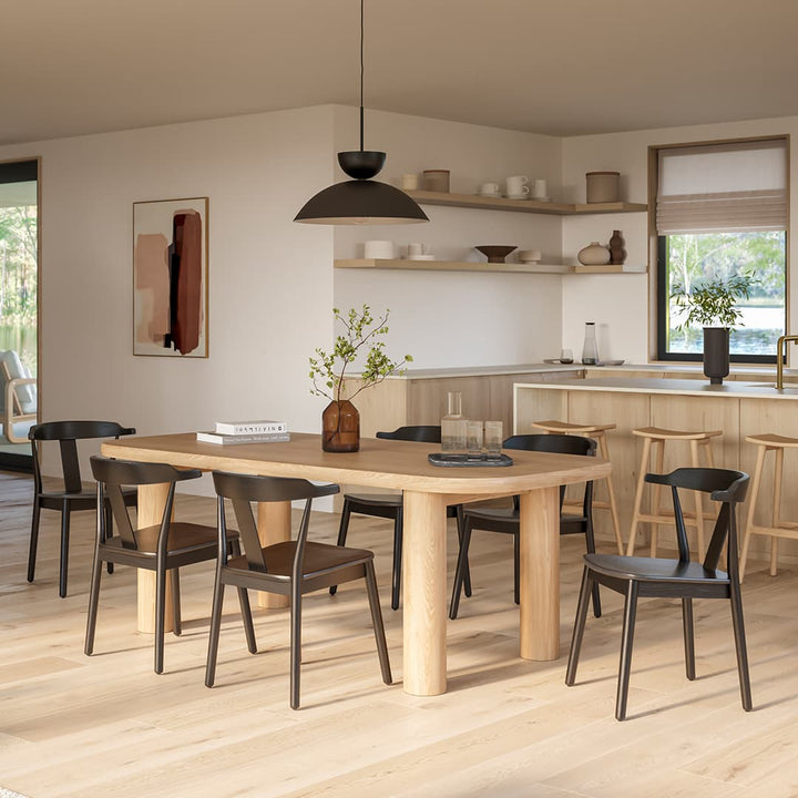 Helia Dining Chair in a farmhouse kitchen with solid wood construction and curved back