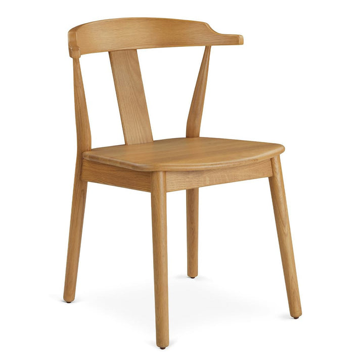 Helia Dining Chair in a farmhouse kitchen with solid wood construction and curved back