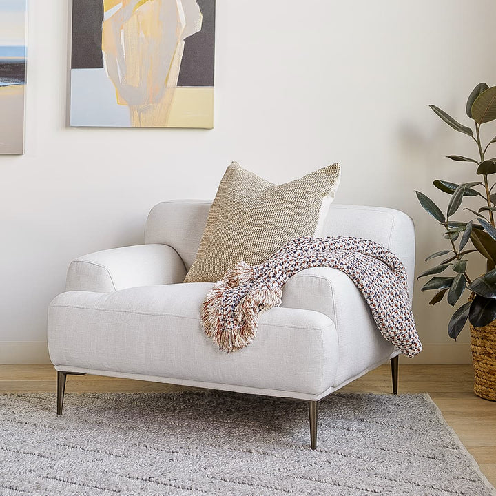 Helio Lounge Chair in quartz white with titanium legs in modern loft interior
