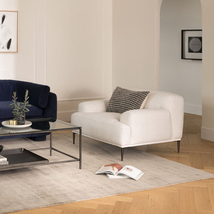 Helio Lounge Chair in quartz white with titanium legs in modern loft interior