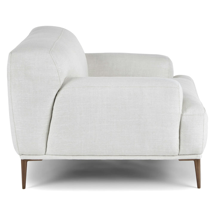 Helio Lounge Chair in quartz white with titanium legs in modern loft interior