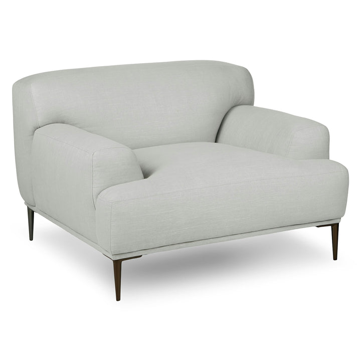 Helio Lounge Chair in quartz white with titanium legs in modern loft interior
