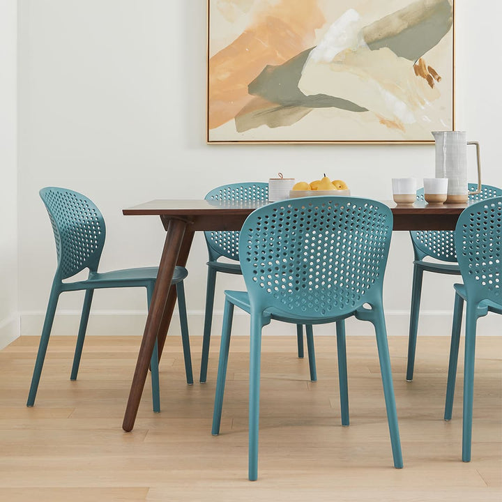 Iris Dining Table in a mid-century modern dining room with solid wood legs and natural wood grain