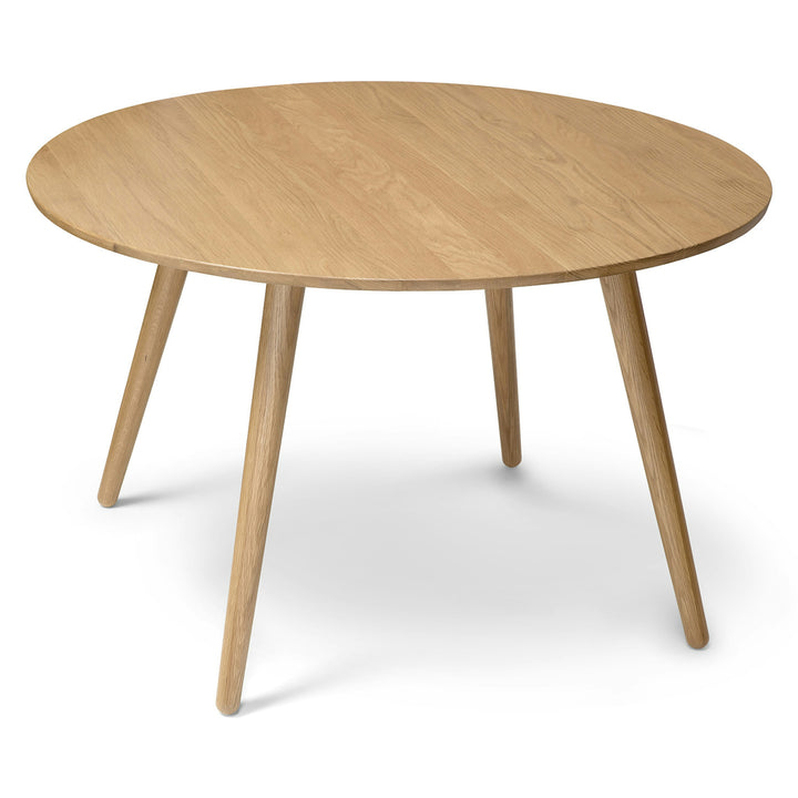 Iris Dining Table in a mid-century modern dining room with solid wood legs and natural wood grain