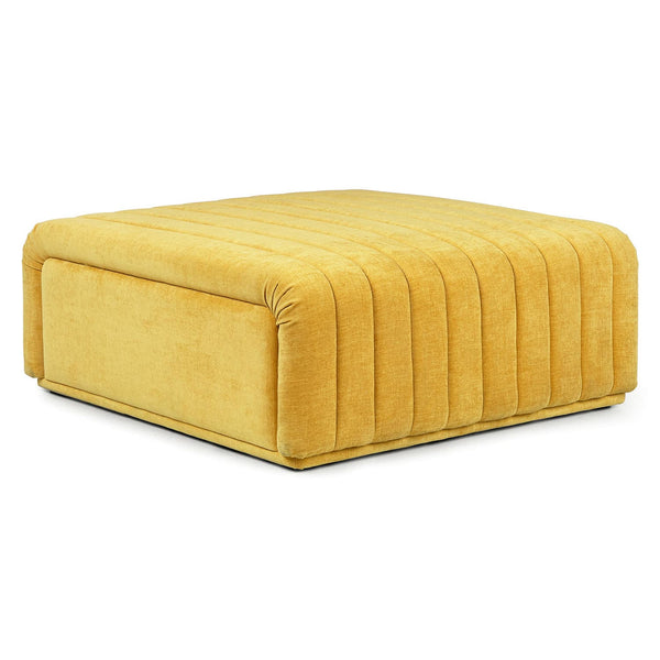 Kiruna Ottoman in a mid-century modern living room with channel-tufted upholstery and wooden legs