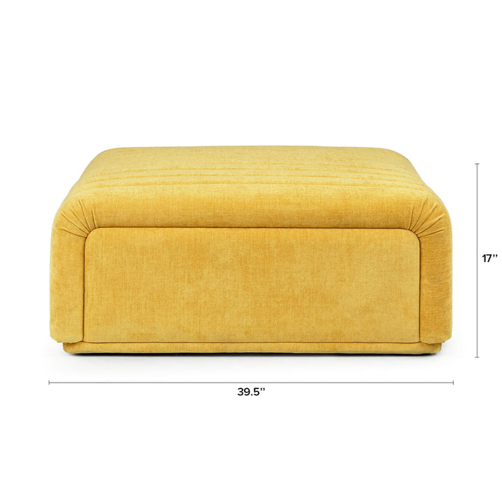 Kiruna Ottoman in a mid-century modern living room with channel-tufted upholstery and wooden legs