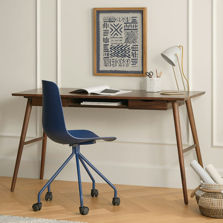 Lira Desk in a modern home office with oak finish, drawers, and keyboard shelf