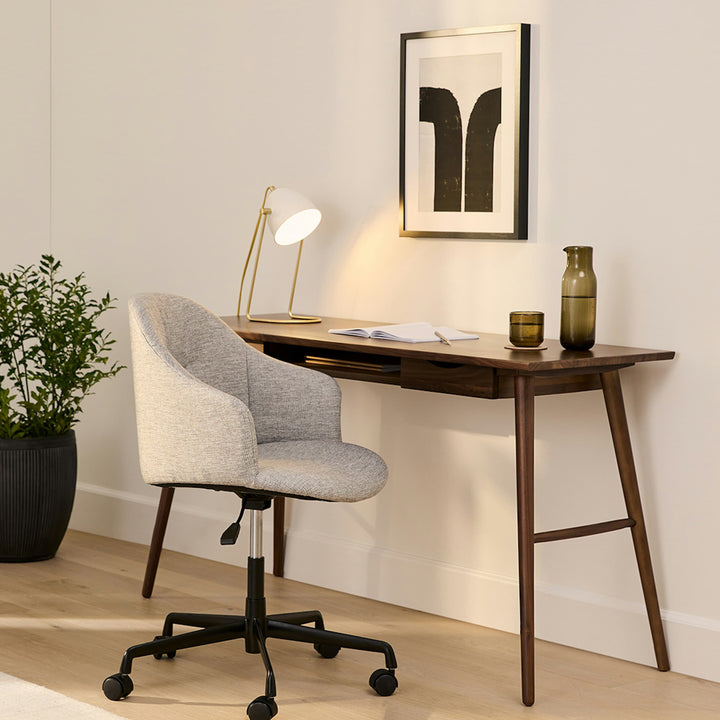 Lira Desk in a modern home office with oak finish, drawers, and keyboard shelf