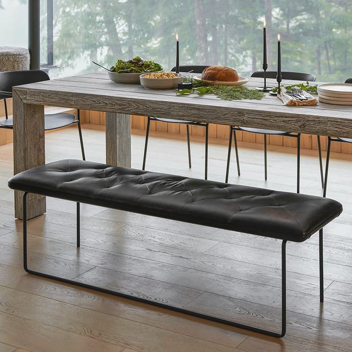 Lyngen Leather Bench with tufted Bella leather and curved steel legs in a modern dining area