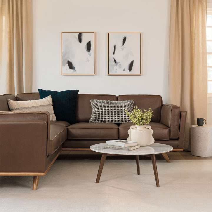 MORA Marble Coffee Table in walnut finish beside sofa with dog bed nearby