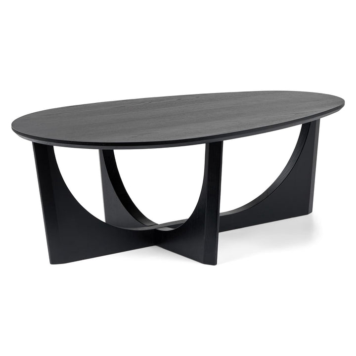 NORDI Coffee Table with sculpted base and natural wood grain in a modern living room